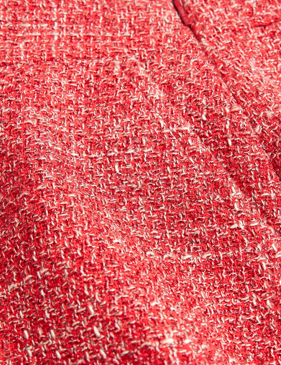 sumis - krojena midi suknja od buklea s prednjim prorezom